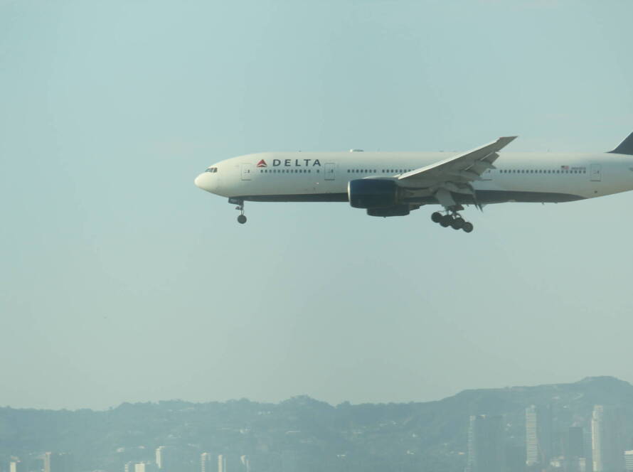 Delta aircraft descending toward LAX with landing gear down, symbolising SME leaders executing a strategic growth plan.